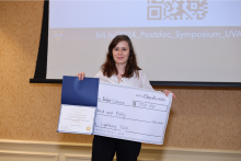 Bonfand holding certificate and check